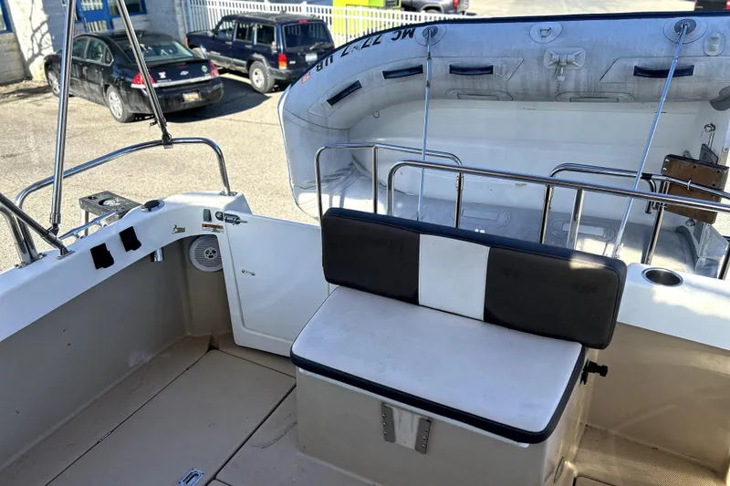 Slide: The Image of 2013 Ranger Tugs R-27 boat interior with seating and inflatable dinghy. - 6