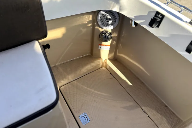 Slide: The Image of 2013 Ranger Tugs R-27 boat interior with speaker and seating area. - 9