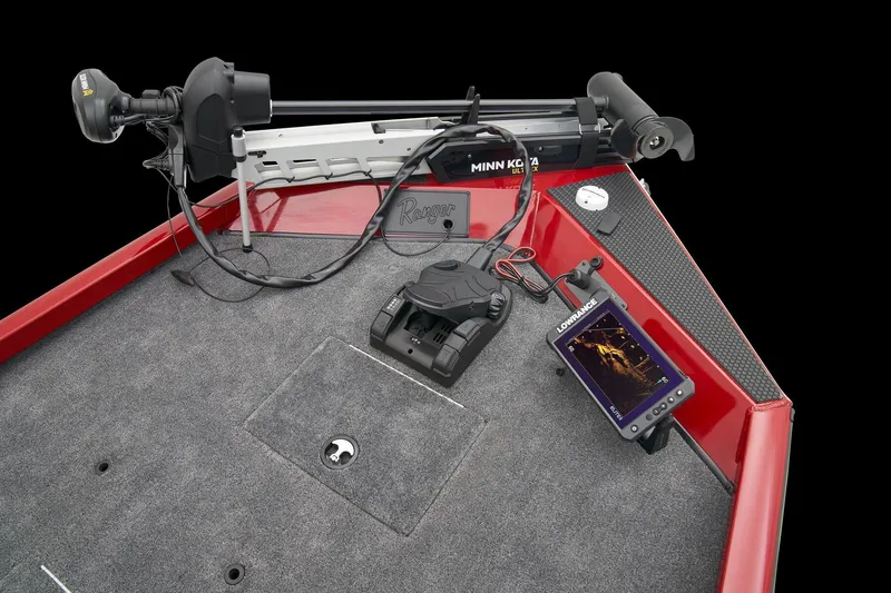 Slide: The Image of 2026 Ranger RT188C boat interior with blue and gray seating on a carpeted deck. - 12