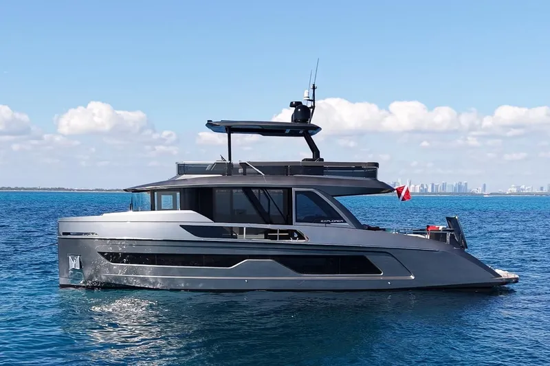 The Image of 2024 Explorer EX62 yacht cruising on blue ocean under clear sky. - 1