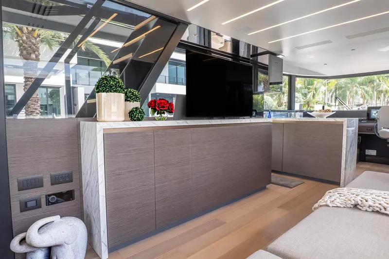 Slide: The Image of Luxurious interior of 2024 Explorer EX62 yacht with modern decor and large windows. - 10