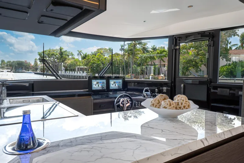 Slide: The Image of Luxurious interior of 2024 Explorer EX62 yacht with modern kitchen and scenic views. - 11