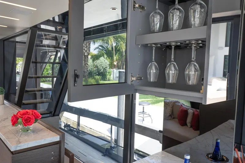 Slide: The Image of Luxurious interior of 2024 Explorer EX62 yacht with glass cabinet and elegant decor. - 12