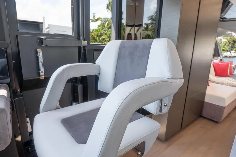 Slide: The Image of Captain's chair in 2024 Explorer EX62 yacht interior, featuring modern design and luxury materials. - 16