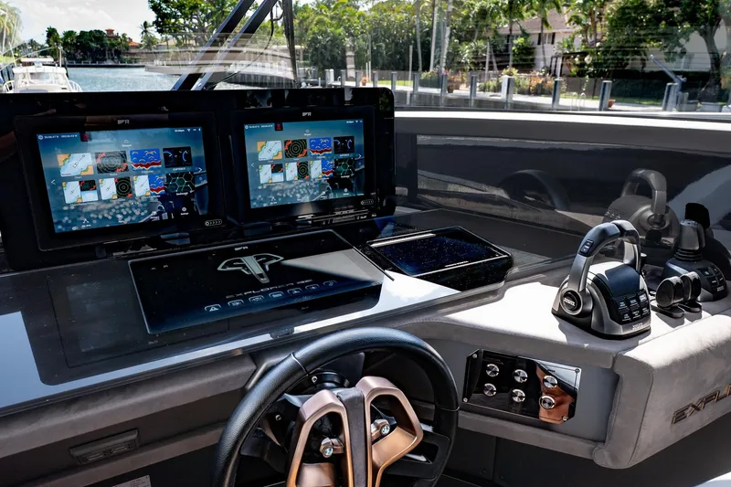 Slide: The Image of 2024 Explorer EX62 yacht cockpit with advanced navigation displays and controls. - 17