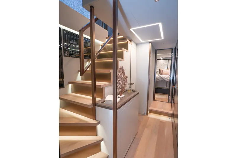 Slide: The Image of Luxurious interior of 2024 Explorer EX62 yacht with elegant staircase and modern design. - 18