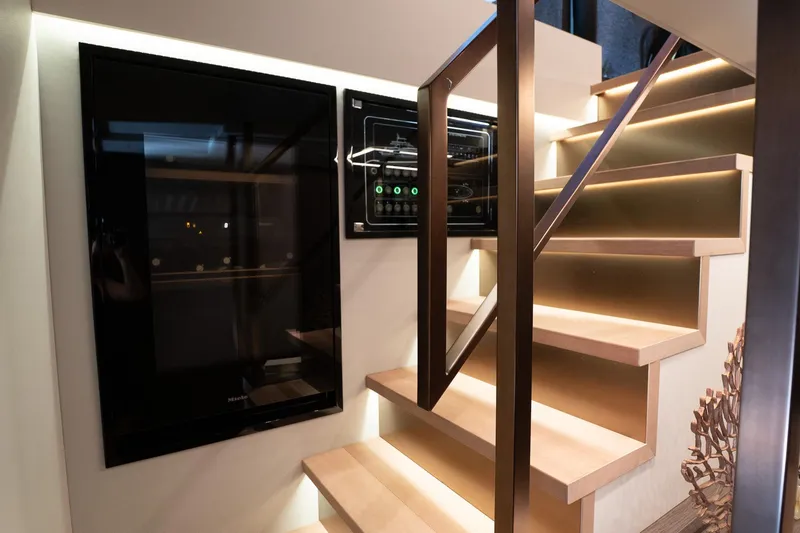 Slide: The Image of Modern staircase with ambient lighting in 2024 Explorer EX62 yacht interior. - 19