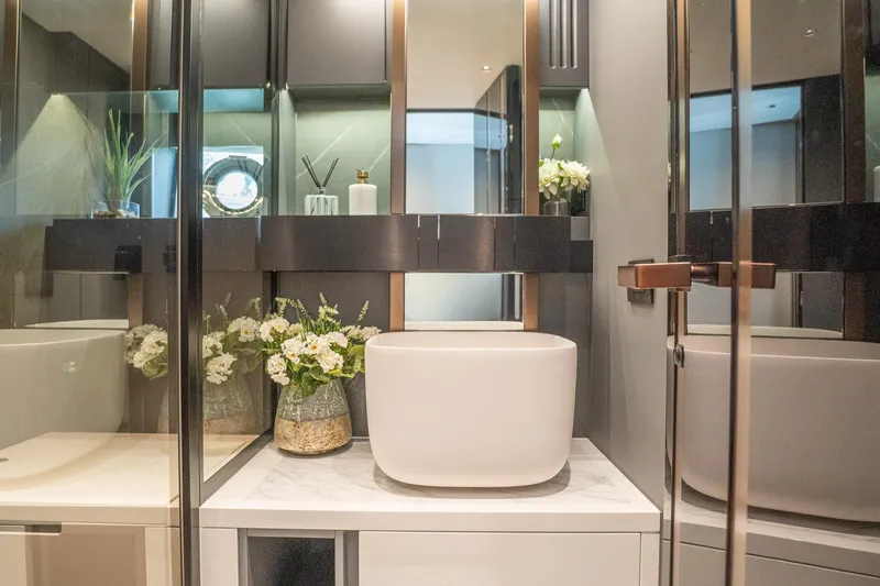 Slide: The Image of Modern bathroom interior with elegant sink and floral decor in Explorer EX62, 2024 model. - 21