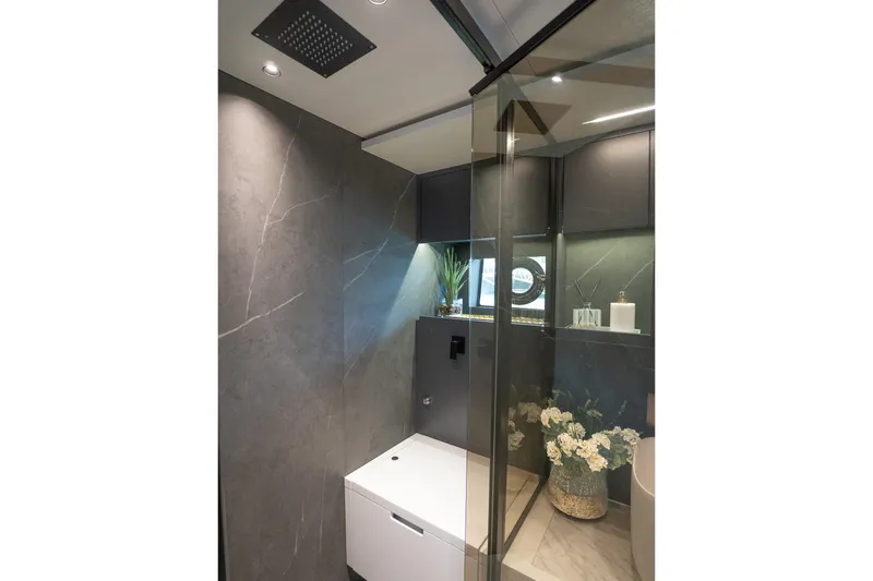 Slide: The Image of Luxurious bathroom interior in 2024 Explorer EX62, featuring modern fixtures and elegant decor. - 23