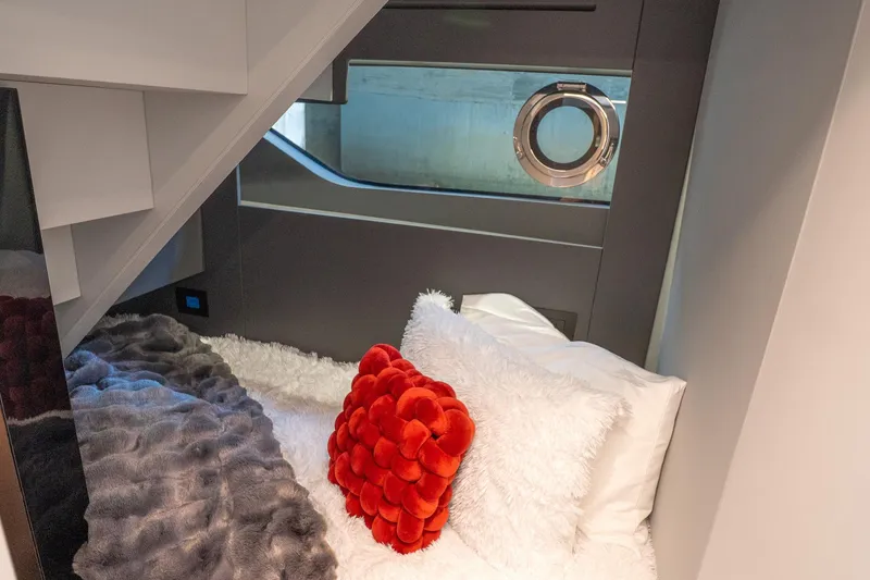 Slide: The Image of Luxurious cabin interior of 2024 Explorer EX62 yacht with plush bedding and porthole window. - 24