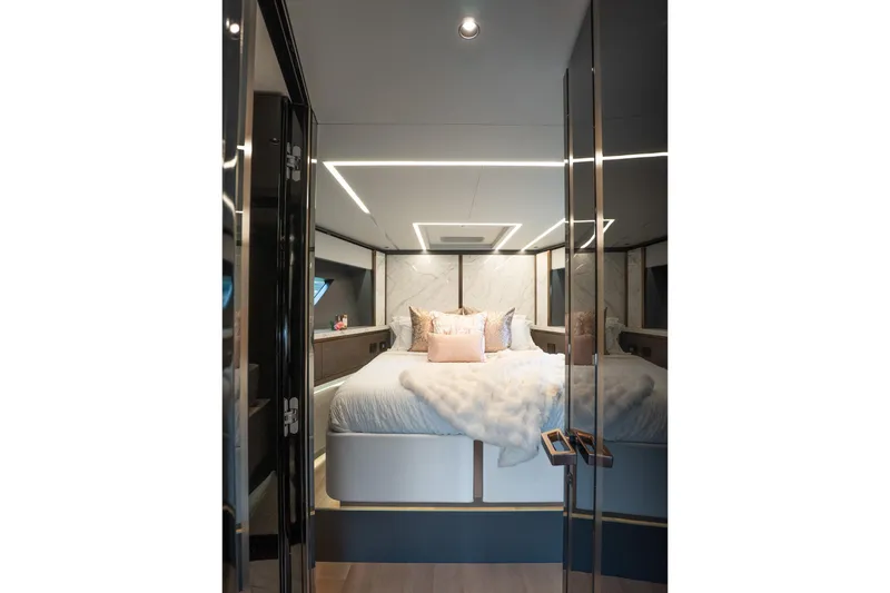 Slide: The Image of Luxurious 2024 Explorer EX62 yacht bedroom with modern lighting and elegant decor. - 25