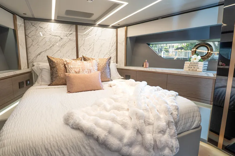 Slide: The Image of Luxurious 2024 Explorer EX62 yacht bedroom with elegant decor and plush bedding. - 26