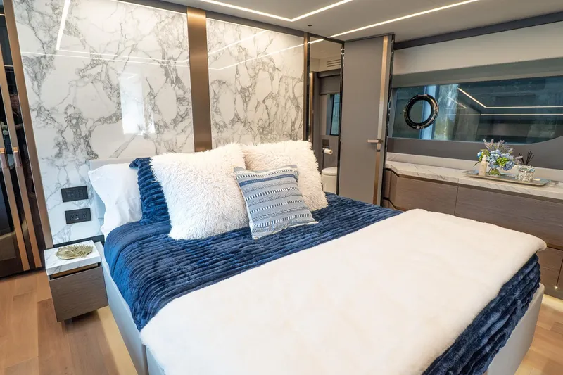 Slide: The Image of Luxurious bedroom interior of 2024 Explorer EX62 yacht with marble accents and plush bedding. - 29