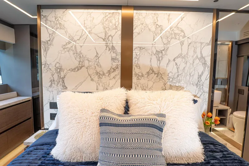 Slide: The Image of Luxurious 2024 Explorer EX62 interior with plush bedding and elegant marble accents. - 31