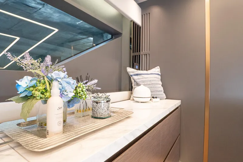 Slide: The Image of Luxurious interior of 2024 Explorer EX62 yacht with elegant decor and floral arrangement. - 34