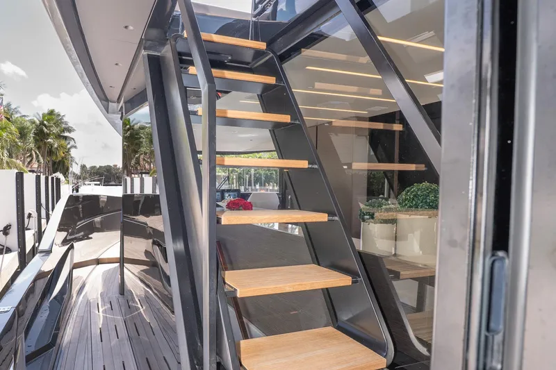 Slide: The Image of Modern Explorer EX62 yacht with sleek wooden stairs and elegant interior, 2024 model. - 35