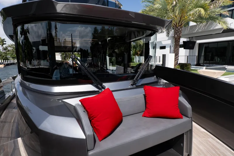 Slide: The Image of 2024 Explorer EX62 yacht with red cushions, sleek design, and modern exterior. - 40