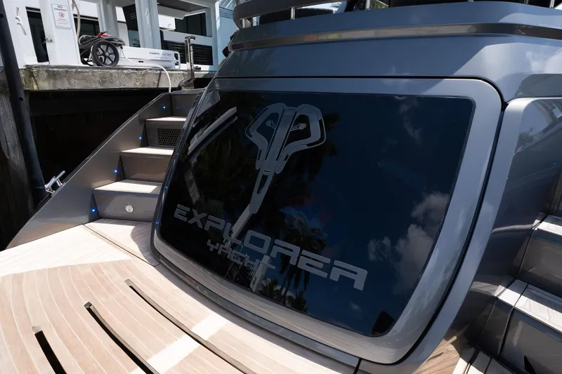 Slide: The Image of 2024 Explorer EX62 yacht with sleek design and modern features at a dock. - 42