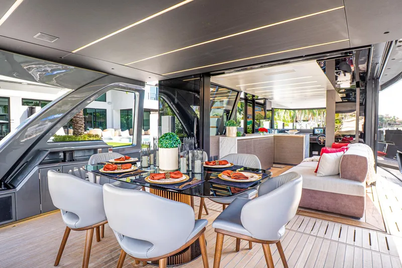 Slide: The Image of Luxurious 2024 Explorer EX62 yacht interior with elegant dining area and modern decor. - 7