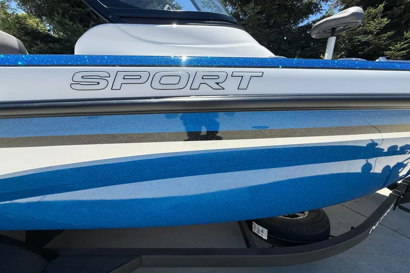 Slide: The Image of 2026 Nitro ZV19 Sport Pro boat with blue and white design, featuring "SPORT" lettering. - 2