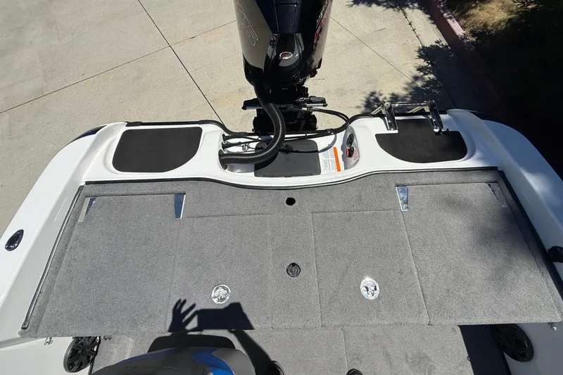 Slide: The Image of 2026 Nitro ZV19 Sport Pro boat deck with motor and storage compartments. - 32
