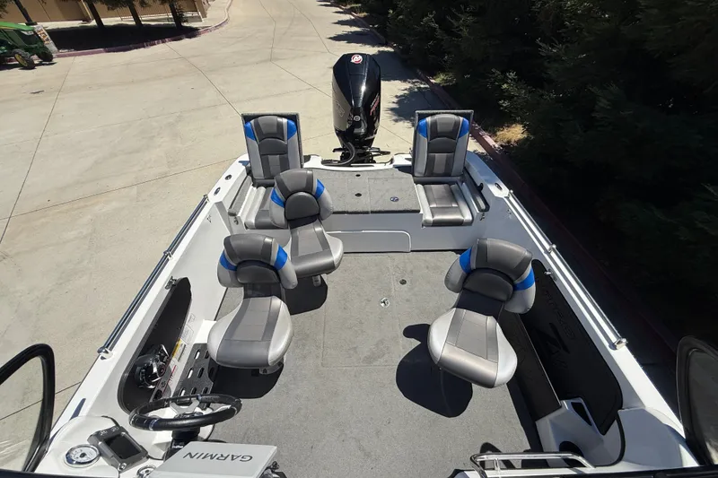 Slide: The Image of 2026 Nitro ZV19 Sport Pro boat interior with seating and Garmin navigation system. - 8