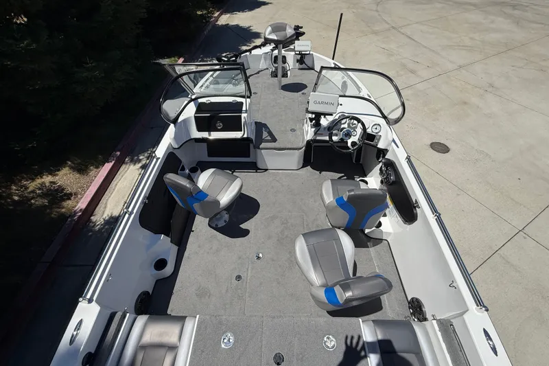 Slide: The Image of 2026 Nitro ZV19 Sport Pro boat interior with seating and steering console. - 7