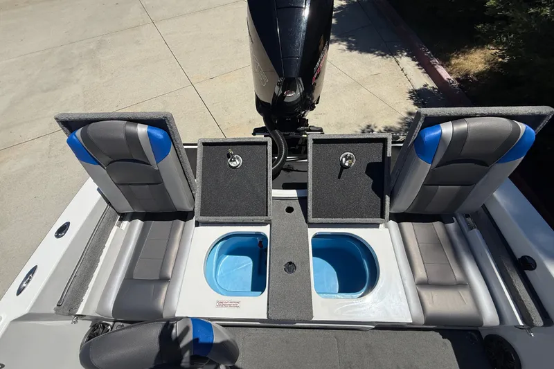 Slide: The Image of 2026 Nitro ZV19 Sport Pro boat interior with open storage compartments and seating. - 26