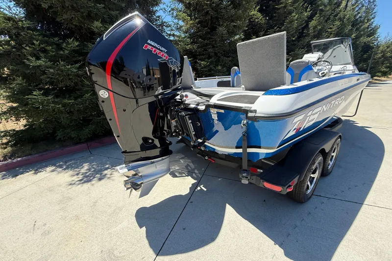 Slide: The Image of 2026 Nitro ZV19 Sport Pro boat with Mercury Pro XS engine on trailer. - 5