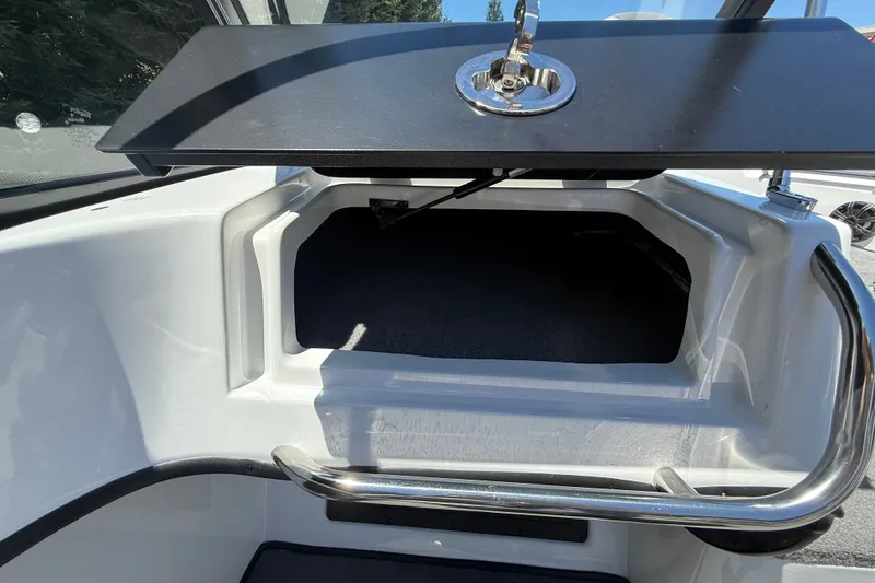 Slide: The Image of Open storage compartment on 2026 Nitro ZV19 Sport Pro boat. - 19