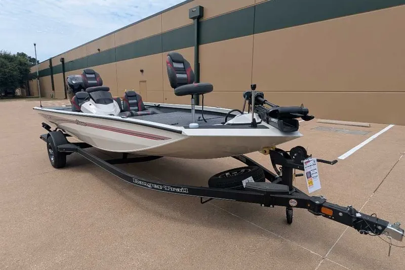 Slide: The Image of 2026 Ranger RT198P fishing boat on trailer, parked outdoors. - 15