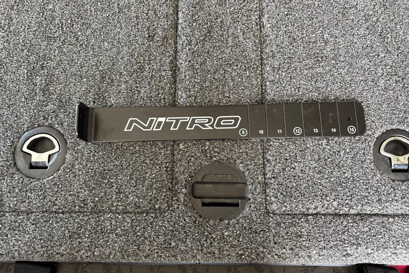 Slide: The Image of 2026 Nitro Z20 XL boat deck with measurement tool and latches. - 34