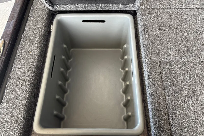 Slide: The Image of Storage compartment in 2026 Nitro Z20 XL boat, featuring a spacious, carpeted interior. - 32