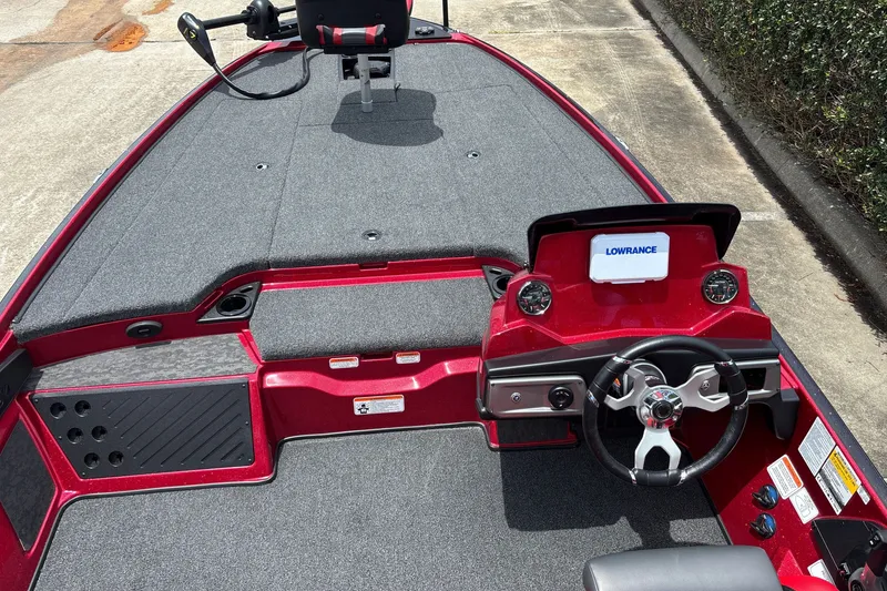 Slide: The Image of Red 2026 Nitro Z20 XL boat interior with steering wheel and Lowrance display. - 16