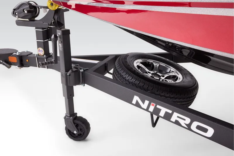 Slide: The Image of 2026 Nitro Z20 XL boat parked outdoors near dealership, showcasing sleek design. - 7