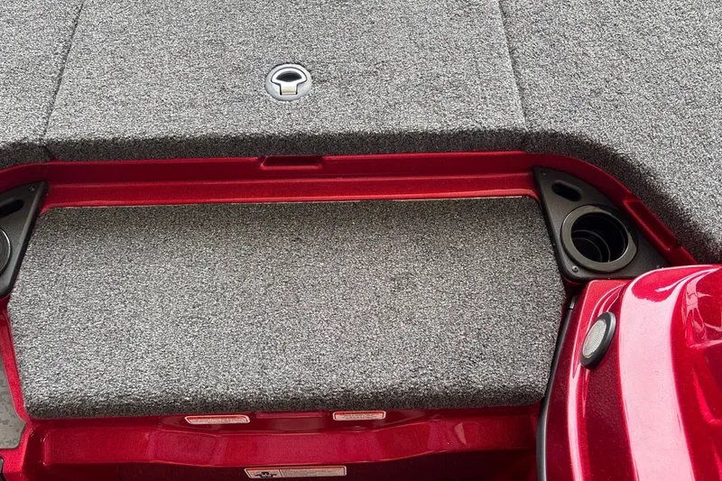Slide: The Image of Carpeted deck of 2026 Nitro Z20 XL boat with cup holders and storage compartment. - 22
