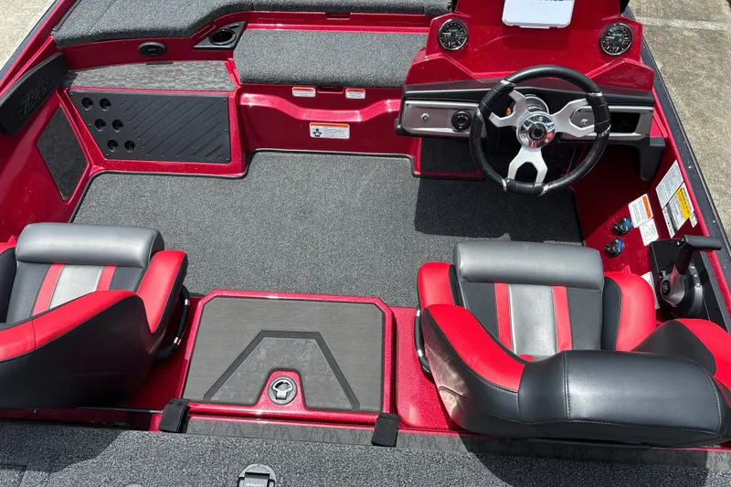 Slide: The Image of Interior of a 2026 Nitro Z20 XL boat with red and black seating. - 12