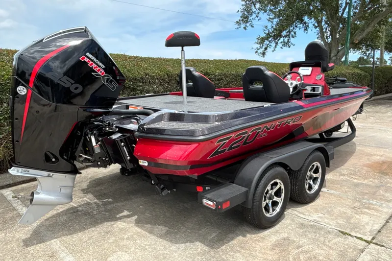 Slide: The Image of 2026 Nitro Z20 XL boat with Mercury Pro XS engine, parked on a trailer. - 6