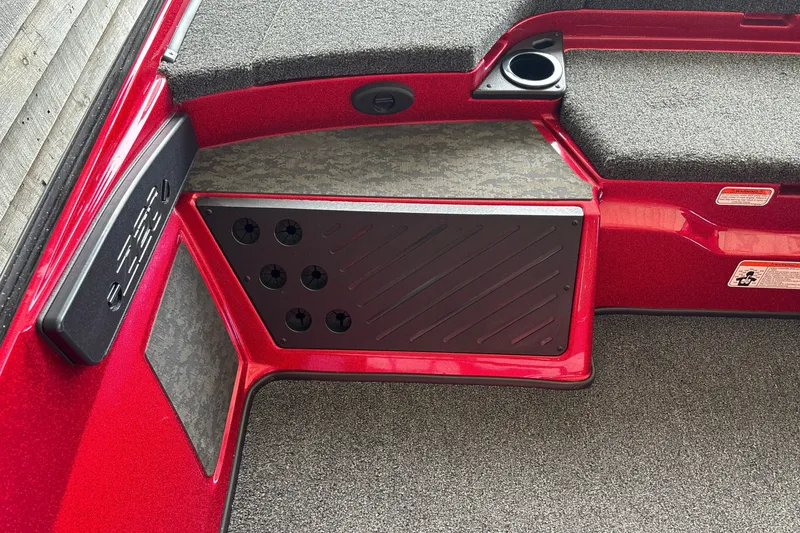 Slide: The Image of Interior of a 2026 Nitro Z20 XL boat with red accents and carpeted flooring. - 26