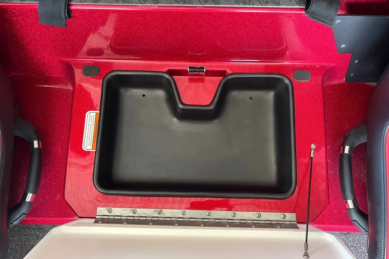 Slide: The Image of Red Nitro Z20 XL 2026 boat compartment with black storage bin and handles. - 20