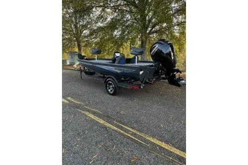 Slide: The Image of 2026 Ranger RT178C boat parked outdoors, featuring sleek design and powerful engine. - 2