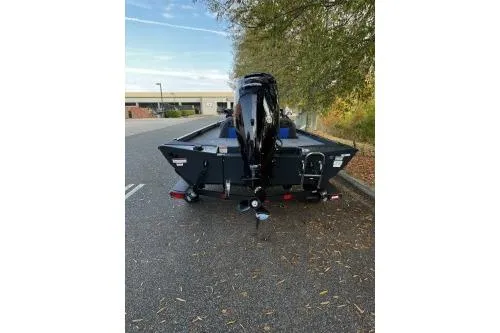 Slide: The Image of 2026 Ranger RT178C boat, rear view, parked outdoors on a sunny day. - 3