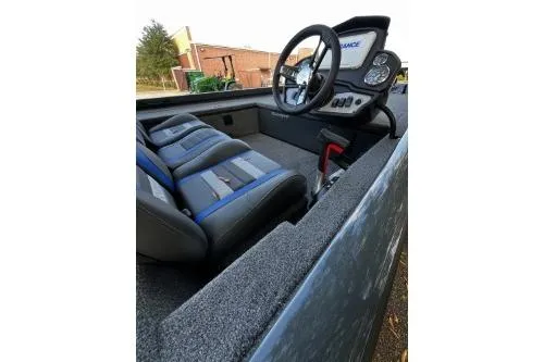 Slide: The Image of 2026 Ranger RT178C boat interior with steering wheel and seats. - 7