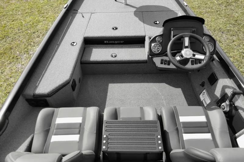 Slide: The Image of Interior view of 2026 Ranger RT178 boat with steering console and seating. - 7