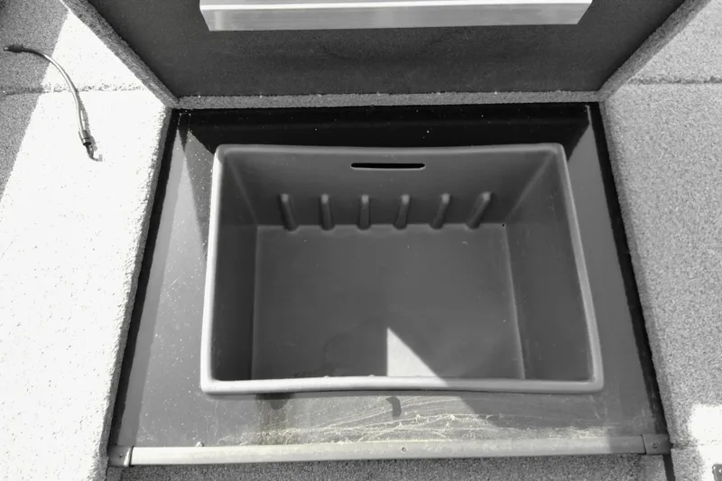 Slide: The Image of 2026 Ranger RT178 boat storage compartment, open and empty, with carpeted edges. - 8