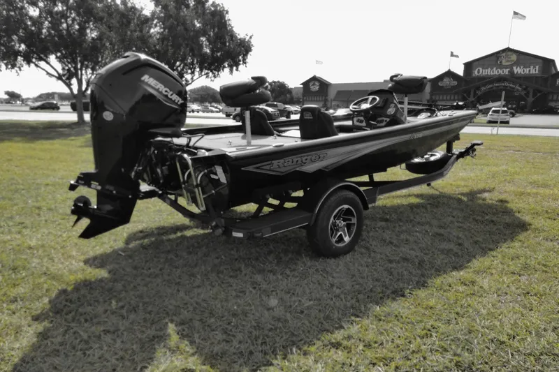 Slide: The Image of 2026 Ranger RT178 boat with Mercury engine on grassy area near Outdoor World store. - 4