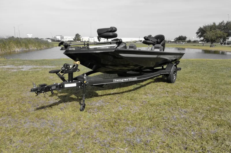The Image of 2026 Ranger RT178 boat on trailer near a pond, showcasing sleek design and modern features. - 0