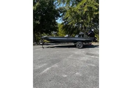 Slide: The Image of 2026 Ranger RT188C boat parked outdoors on a sunny day. - 1