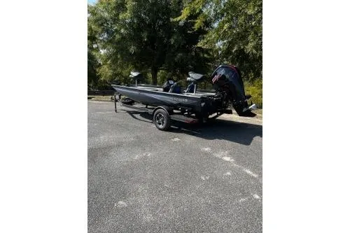 Slide: The Image of 2026 Ranger RT188C boat parked outdoors on a sunny day. - 3