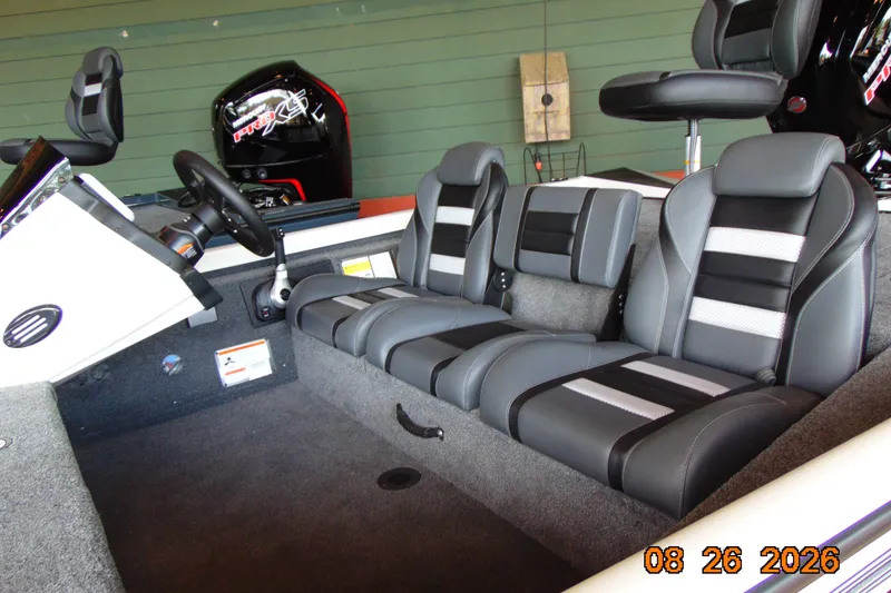 Slide: The Image of 2026 Ranger RT188 boat interior with modern seating and steering wheel. - 13